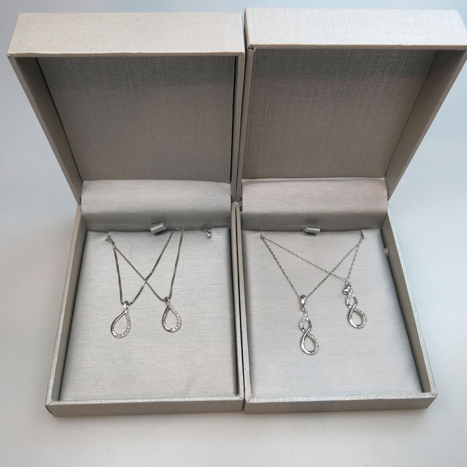 Two Pairs Of Sterling Silver Pendants and Chains